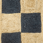 Handwoven scalloped jute rug with natural beige tones, showcasing wavy edges and textured fibers in a coastal-themed living room.